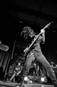 The bassist in full swing as the vocalist catches a little break at the drum dais.<br/><span class='courtesyName'> Photo Courtesy - Margub Ali  </span> 